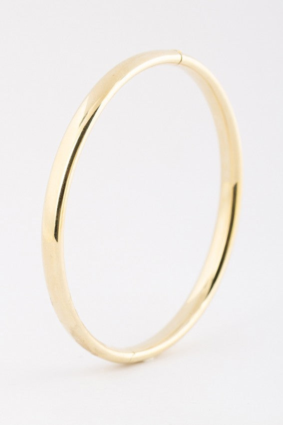 Gold bangle with cap closure