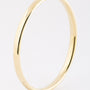Gold bangle with cap closure