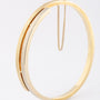 White/yellow gold matte bangle with hinge closure