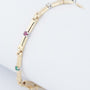 Gold link bracelet with emeralds, rubies, sapphires and diamonds
