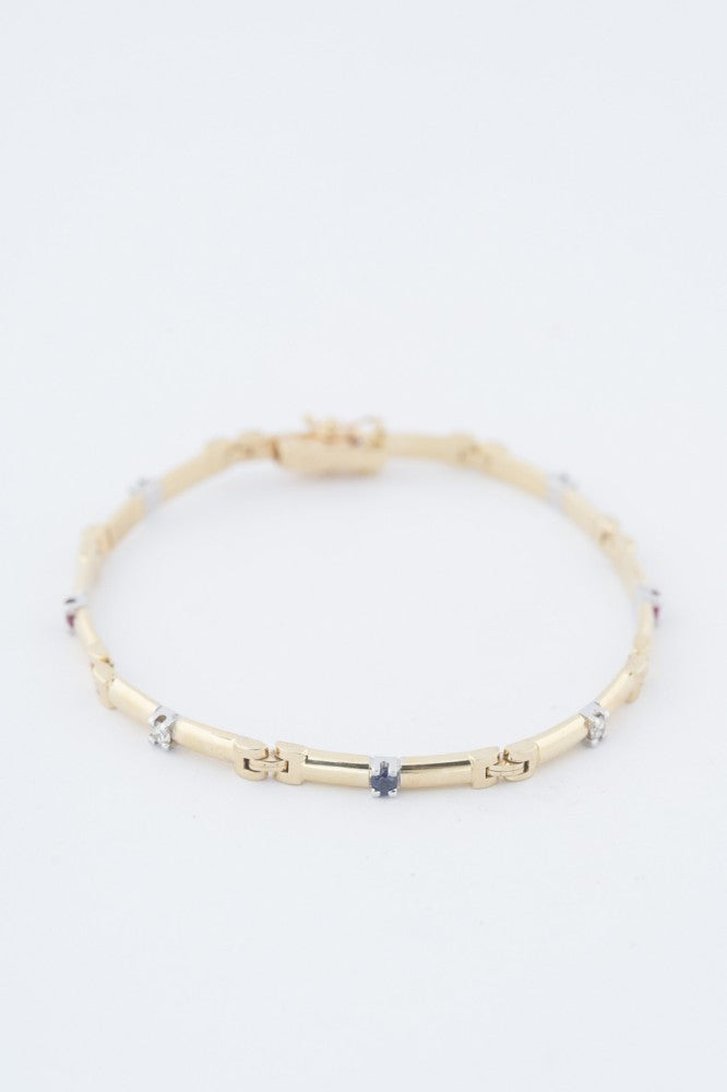 Gold link bracelet with emeralds, rubies, sapphires and diamonds