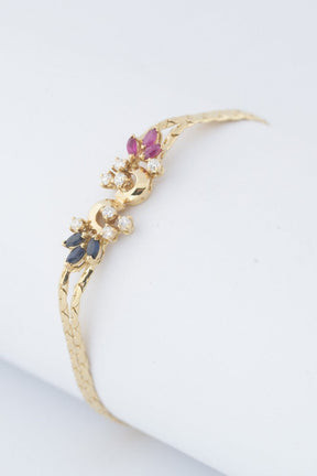 Gold bracelet with sapphire, ruby ​​and 8 diamonds