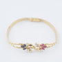 Gold bracelet with sapphire, ruby ​​and 8 diamonds