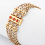 4-strand gold jasseron link bracelet with gold clasp and blood corals
