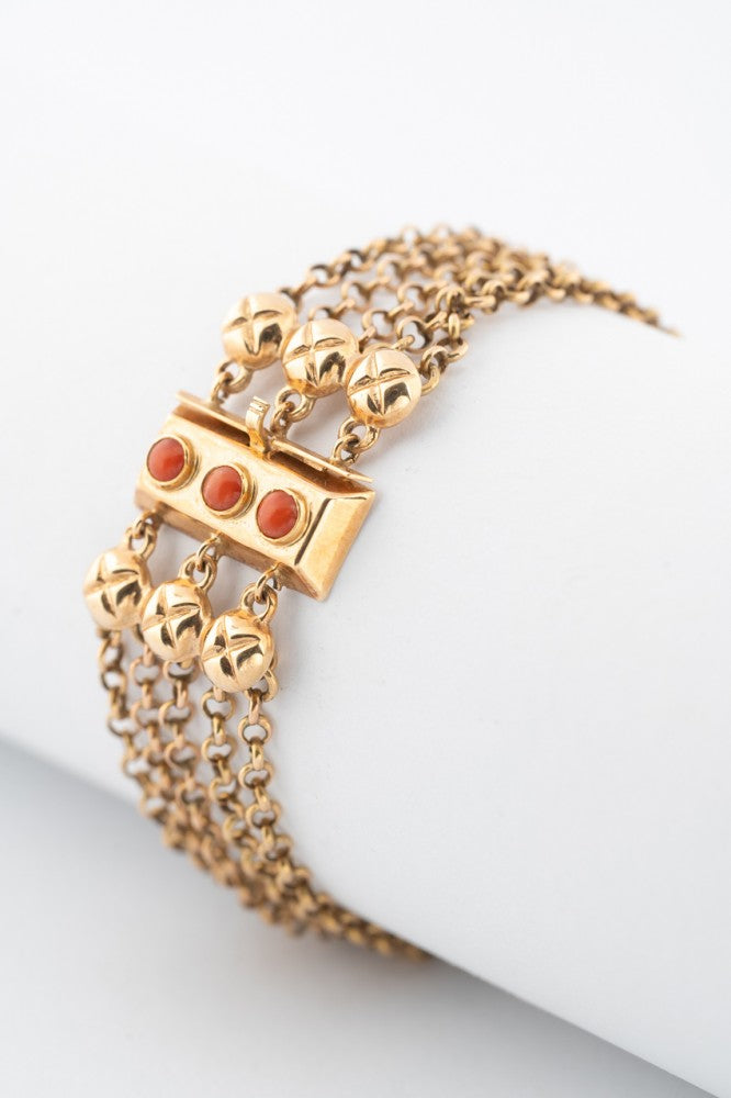 4-strand gold jasseron link bracelet with gold clasp and blood corals