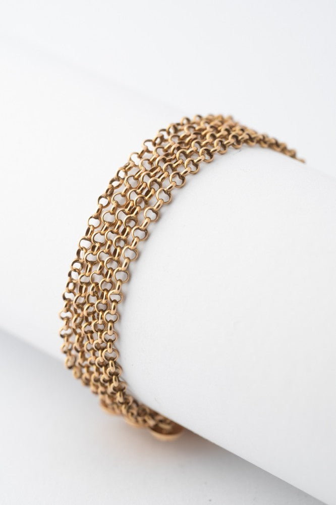 4-strand gold jasseron link bracelet with gold clasp and blood corals