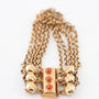 4-strand gold jasseron link bracelet with gold clasp and blood corals