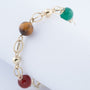 Gouden schakel armband met carneool, wit agaat, groen agaat en tijgeroog