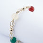 Gouden schakel armband met carneool, wit agaat, groen agaat en tijgeroog