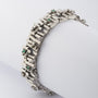 White gold link bracelet with emerald and diamond