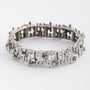 White gold link bracelet with emerald and diamond