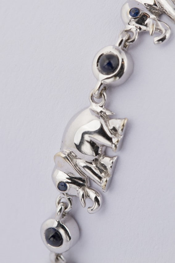 white gold link bracelet with elephants