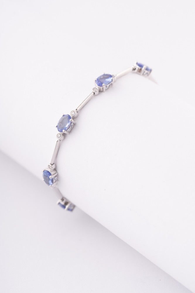 Wit gouden schakel armband met tanzanieten en briljanten