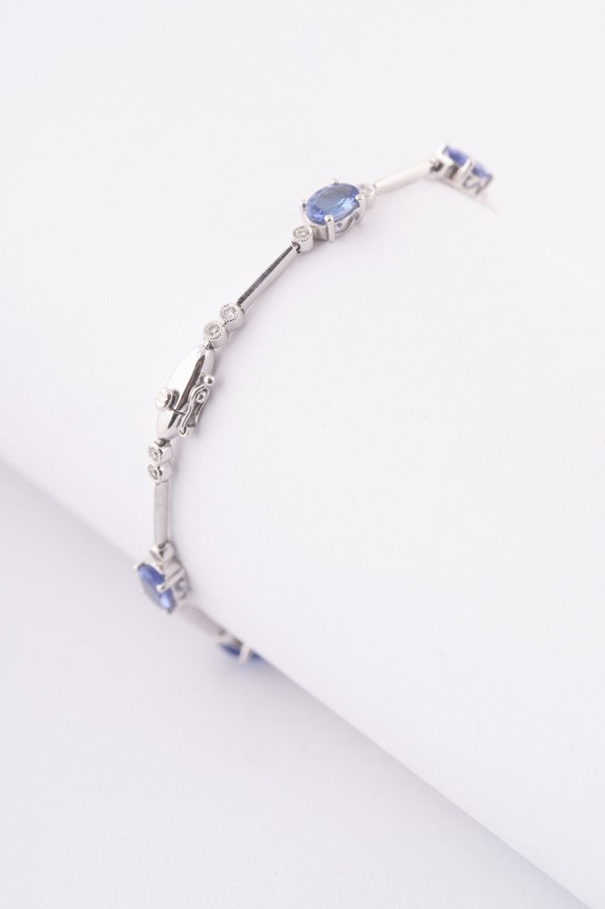 Wit gouden schakel armband met tanzanieten en briljanten