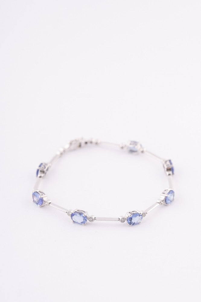 Wit gouden schakel armband met tanzanieten en briljanten