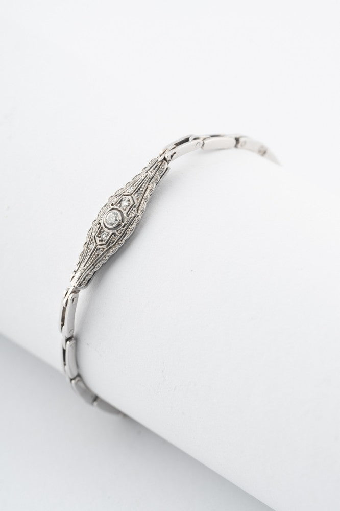 Wit gouden Art Deco schakel armband met een briljant en diamanten