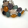 Silver link bracelet with various gemstones