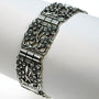 Silver bracelet with floral motifs.