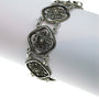 Silver filigree link bracelet.