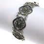 Silver filigree link bracelet.