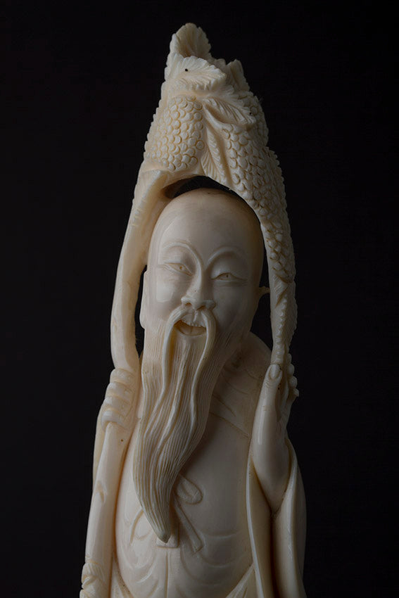 Old ivory sculpture of a philosopher