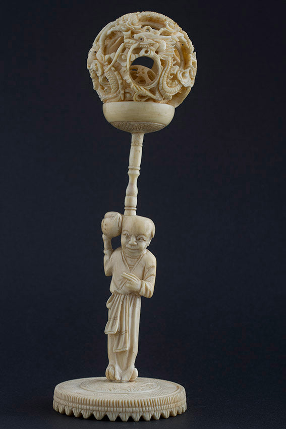 Ivory lucky ball carried by a man