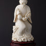 Old ivory sculpture of a man with a money bag and ruji
