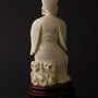 Old ivory sculpture of a man with a pipe