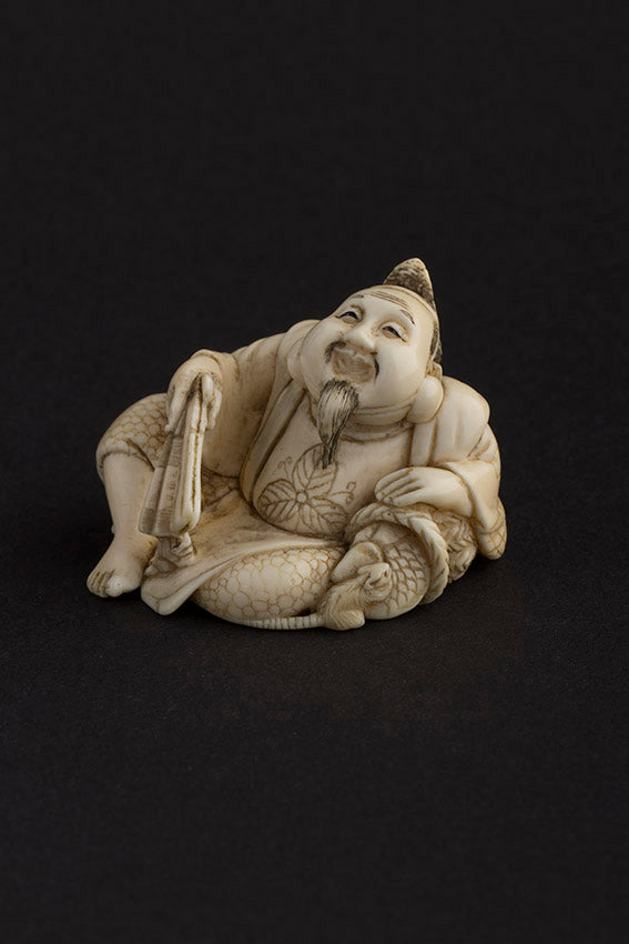 Ivory hotei with fan and rat