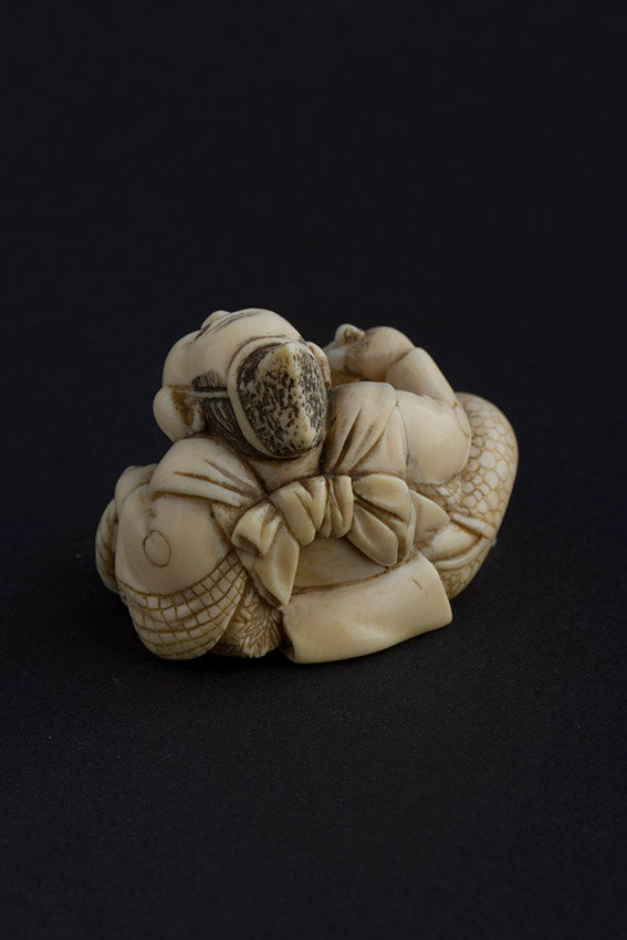 Ivory hotei with fan and rat