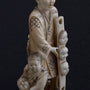 Antique ivory okimono, so-called mask seller