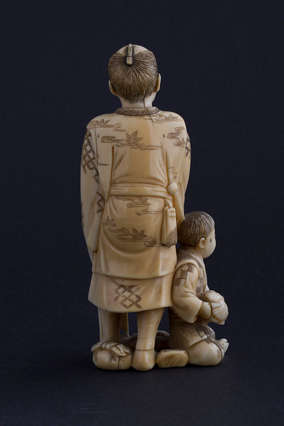 Antique ivory okimono, so-called mask seller