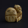 Antique ivory netsuké man with Darma doll