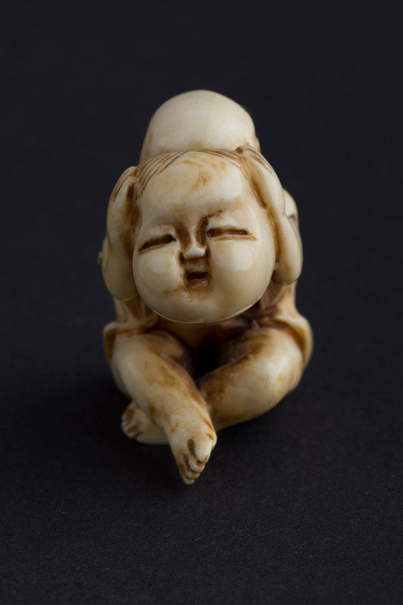 Antique ivory netsuké man with moving mask