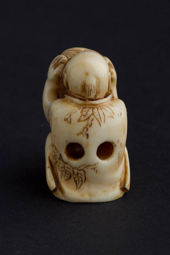 Antique ivory netsuké man with moving mask