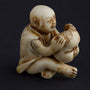 Antique ivory netsuké man with moving mask