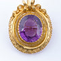 Antique gold brooch with amethyst