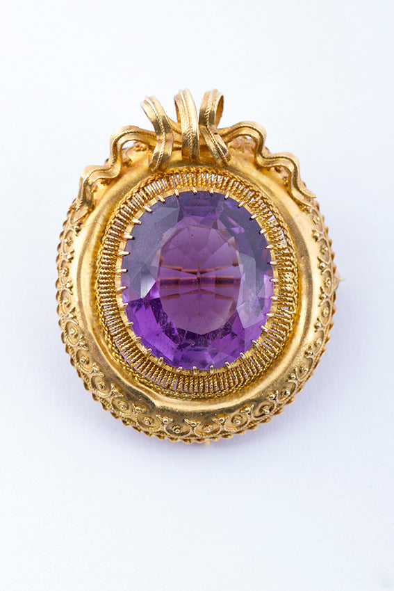 Antique gold brooch with amethyst