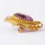 Antique gold brooch with amethyst