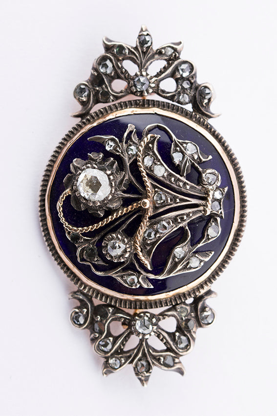 Antique gold brooch with enamel