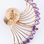 Gouden knoopbroche met amethist
