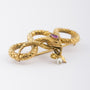Antiek gouden slangen broche met robijn