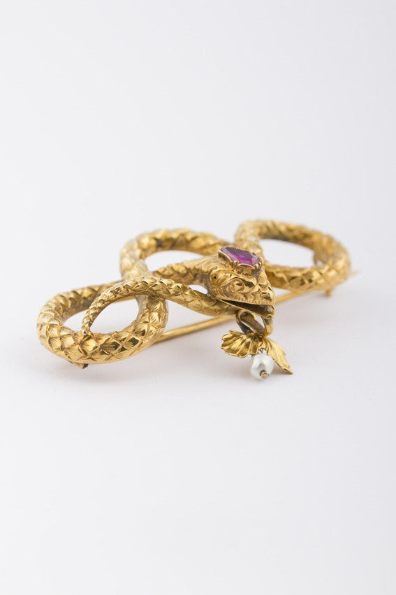 Antiek gouden slangen broche met robijn