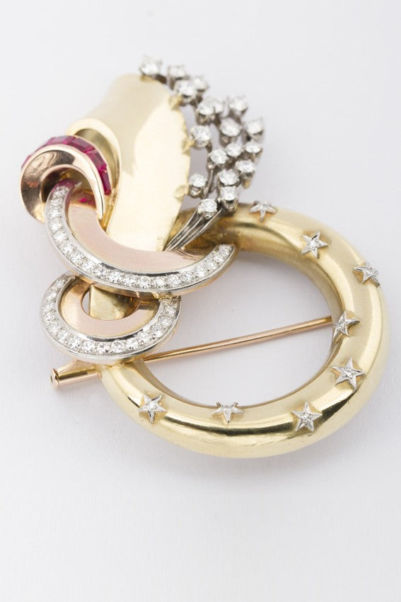 Gouden 50-jaren broche met robijn en briljant