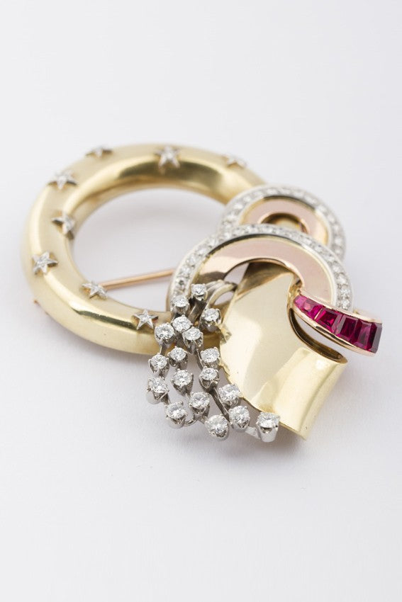 Gouden 50-jaren broche met robijn en briljant