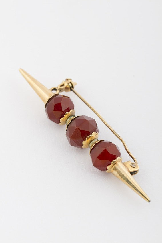 Golden skewer with carnelian