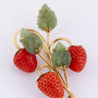 Golden strawberry brooch