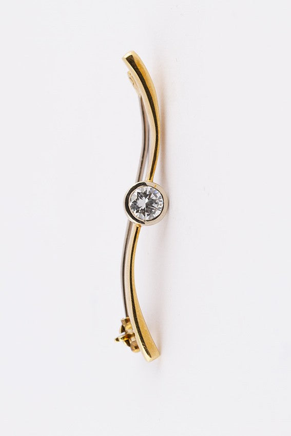 Golden brochette with a brilliant