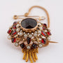 Gouden broche met granaten en parels