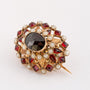 Gouden broche met granaten en parels